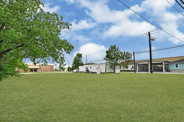 a view of outdoor space with garden and trees
