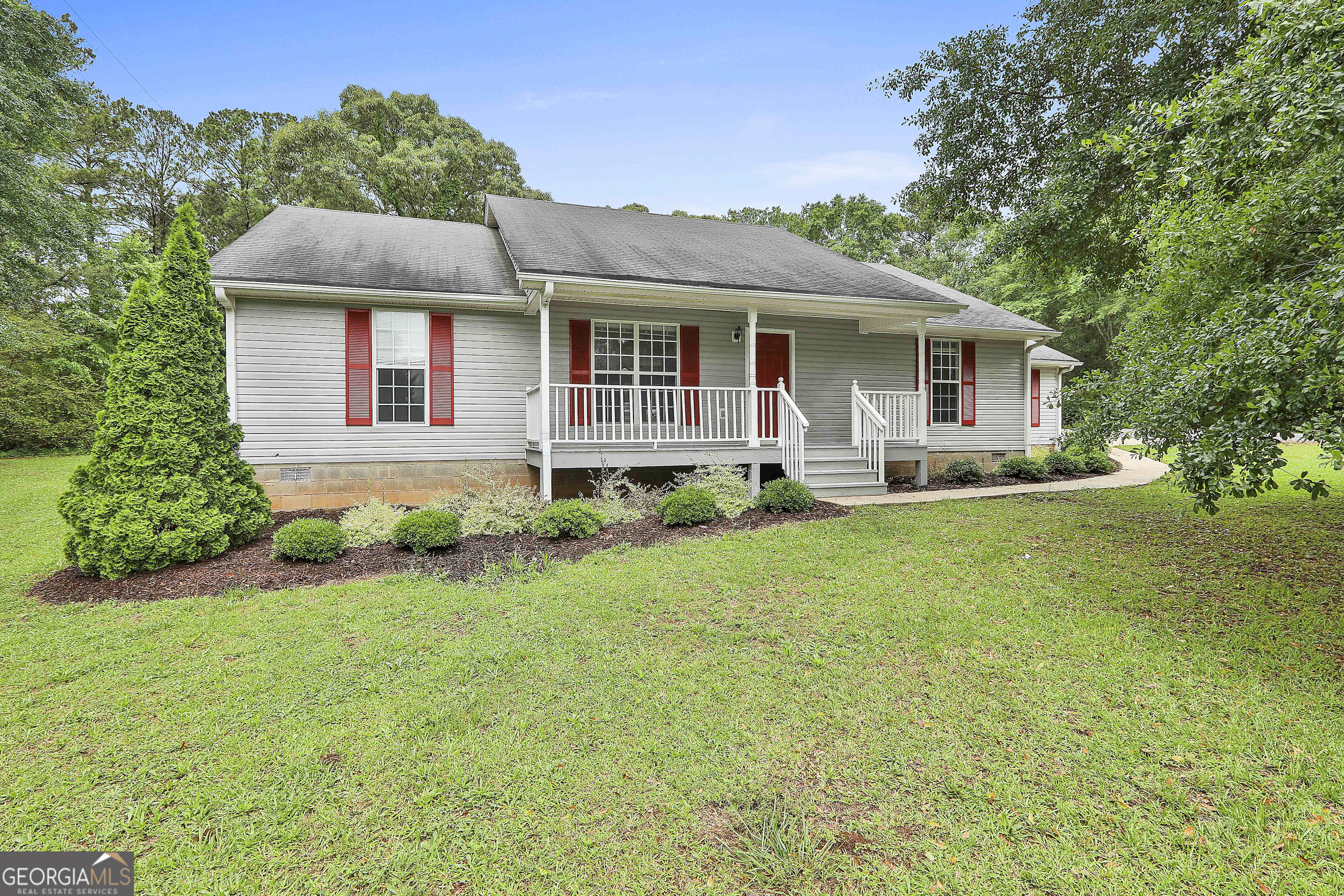 1111 Daniel Road Thomaston, GA 30286 - Photo 1 of 1 a front view of house with yard and green space