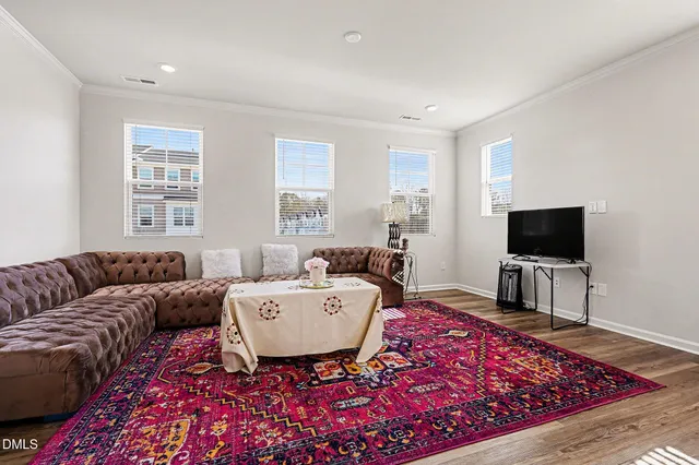 a kitchen with microwave a stove and cabinets