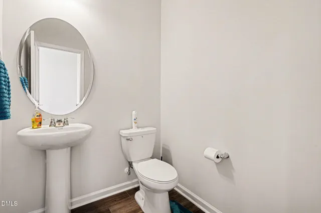 a kitchen with sink stove and refrigerator