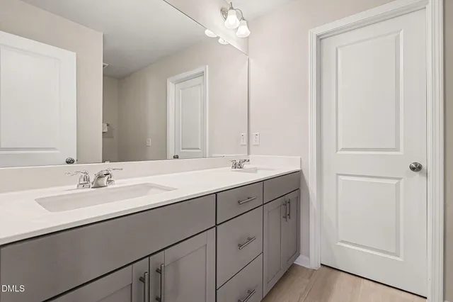 a spacious bedroom with a bed and a window