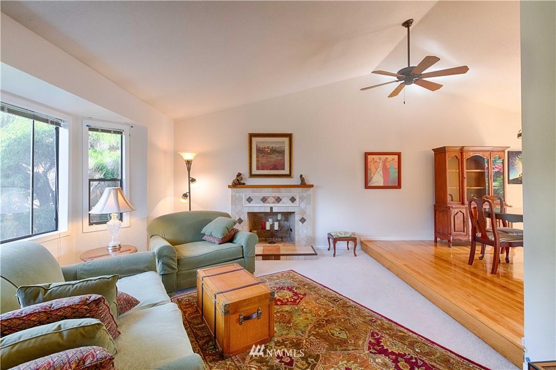 7902 211th Place Southwest Edmonds, WA 98026 - Photo 12 of 33 a living room with fireplace furniture and a large window