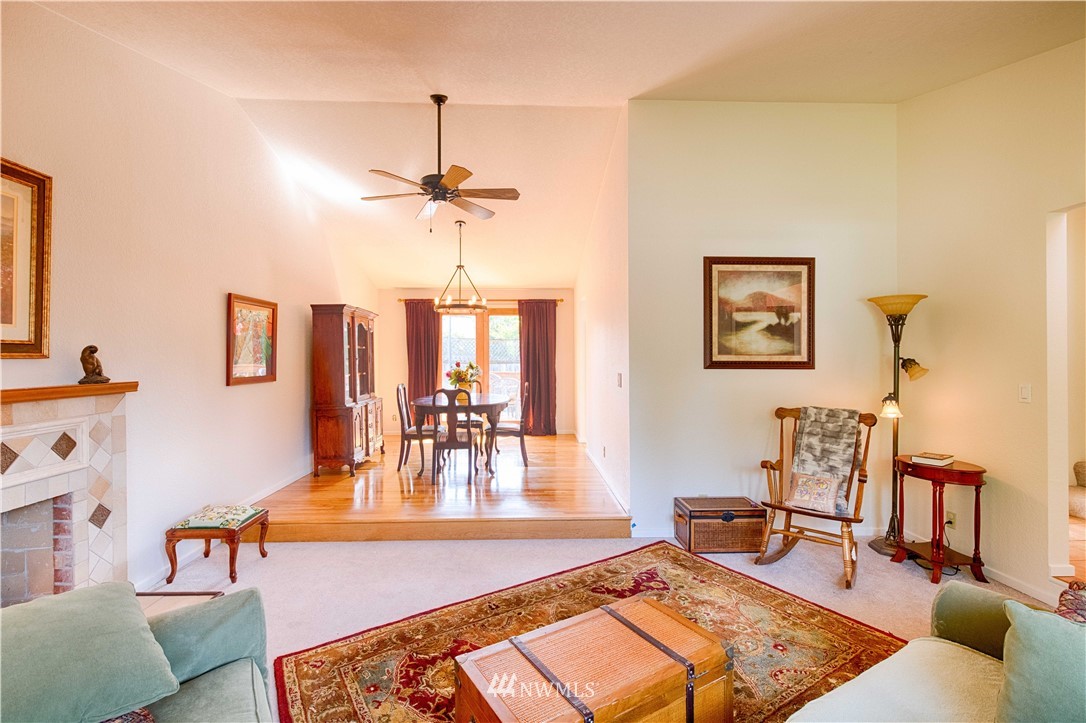 7902 211th Place Southwest Edmonds, WA 98026 - Photo 13 of 33 a living room with furniture and wooden floor