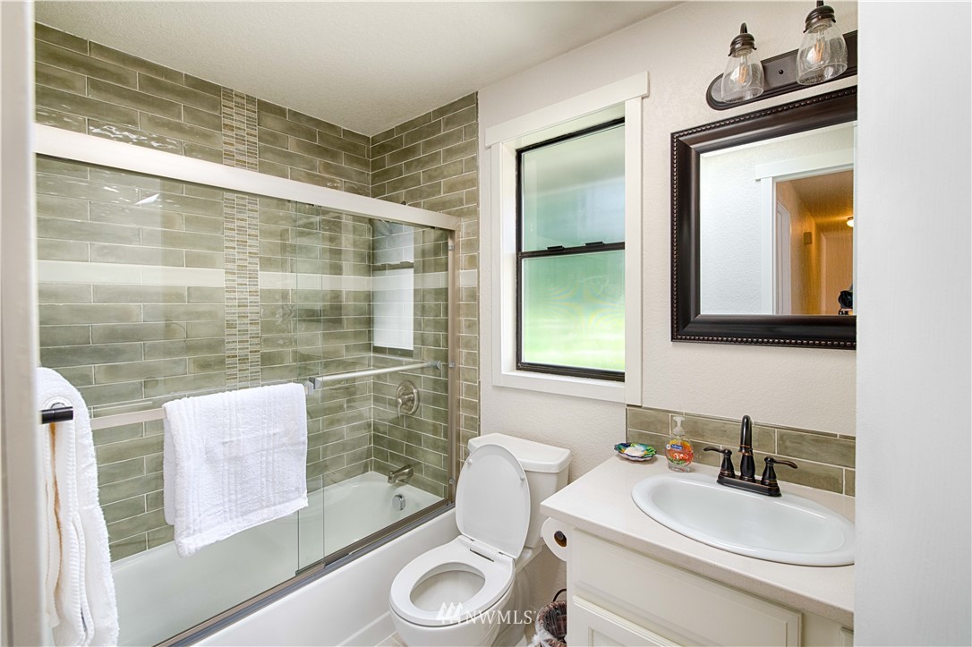 7902 211th Place Southwest Edmonds, WA 98026 - Photo 17 of 33 a bathroom with a sink toilet and mirror