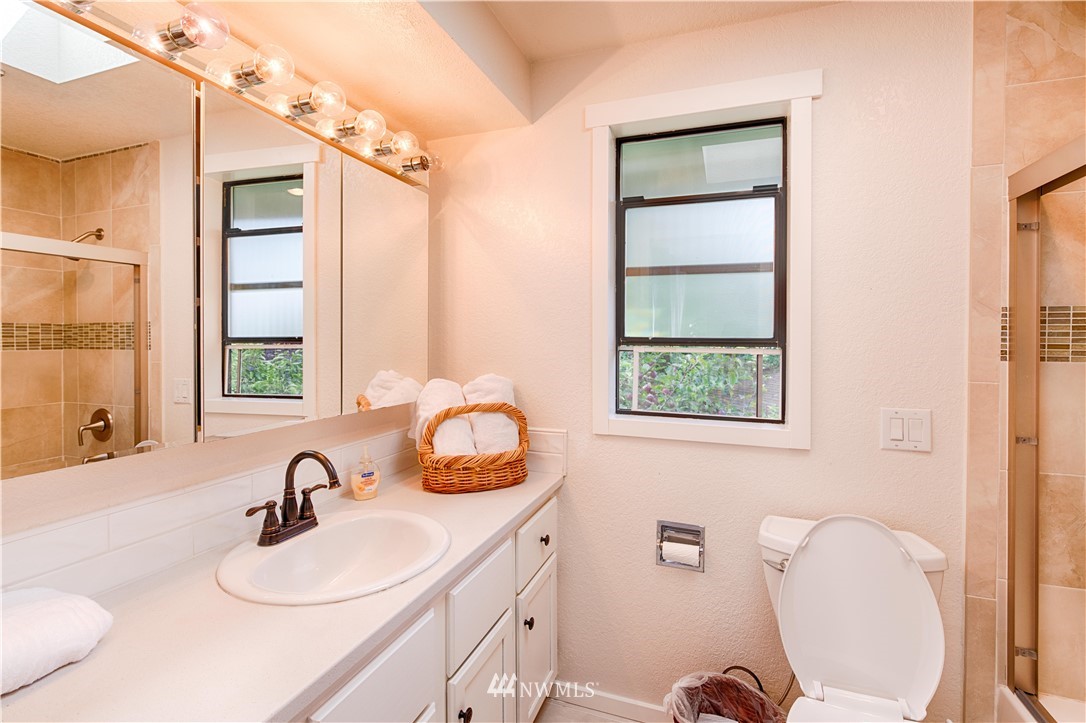 7902 211th Place Southwest Edmonds, WA 98026 - Photo 20 of 33 a bathroom with a sink vanity mirror and toilet
