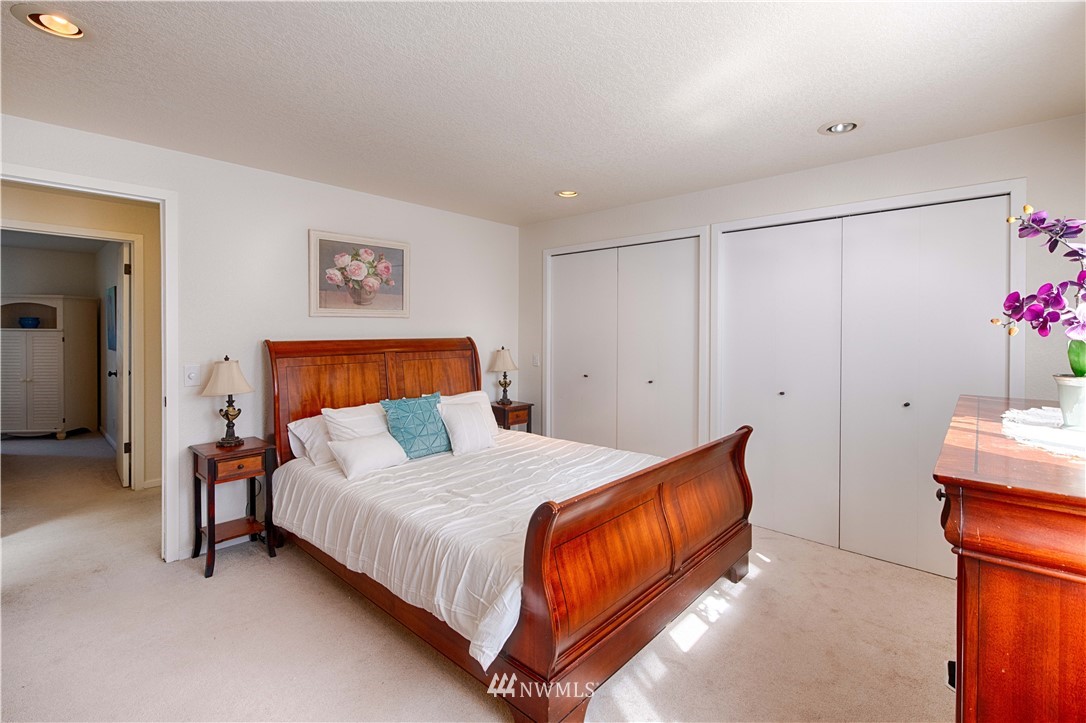 7902 211th Place Southwest Edmonds, WA 98026 - Photo 21 of 33 a bedroom with a bed and a table in it