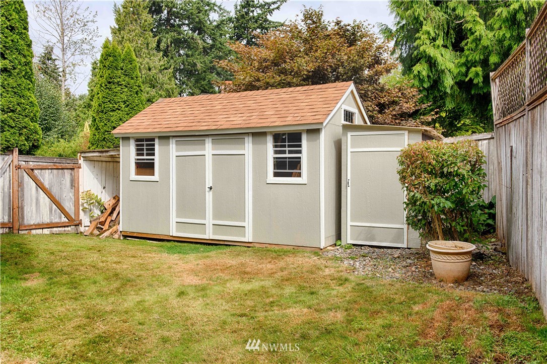 7902 211th Place Southwest Edmonds, WA 98026 - Photo 32 of 33 a view of a house with backyard and garden