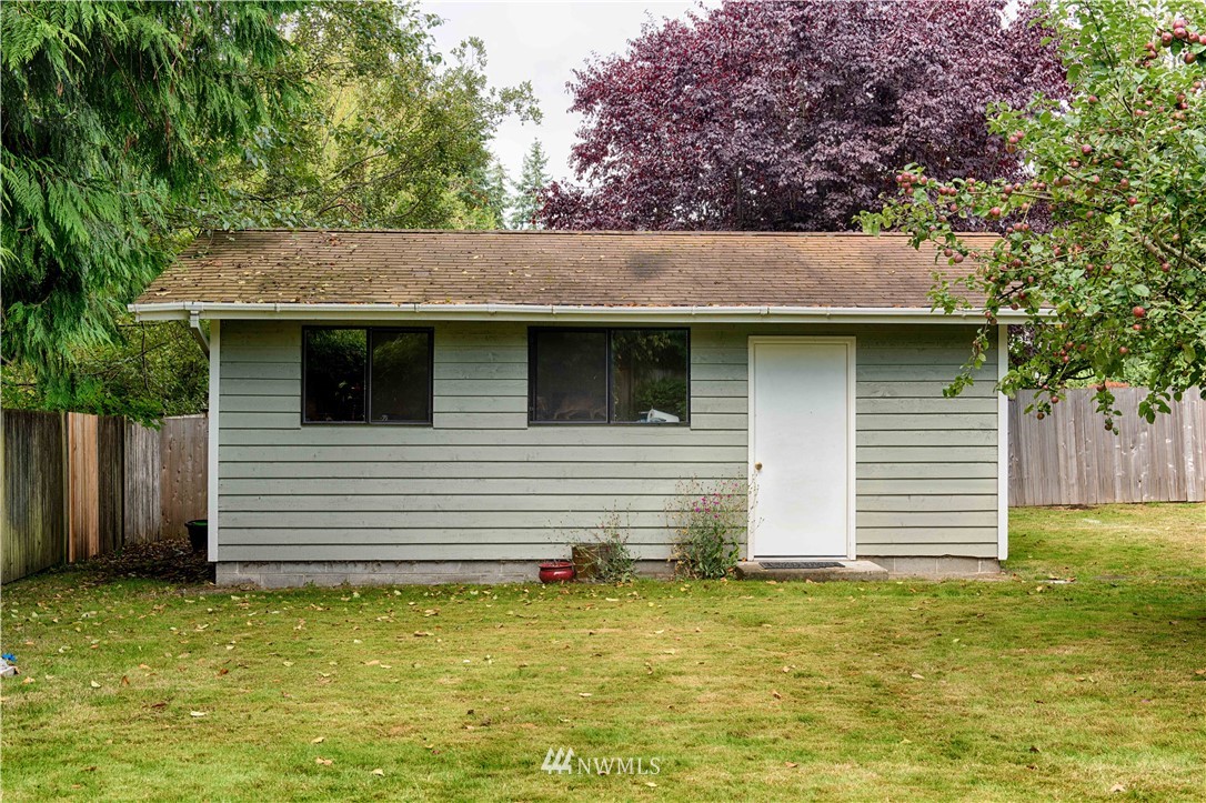 7902 211th Place Southwest Edmonds, WA 98026 - Photo 5 of 33 a front view of a house with a garden