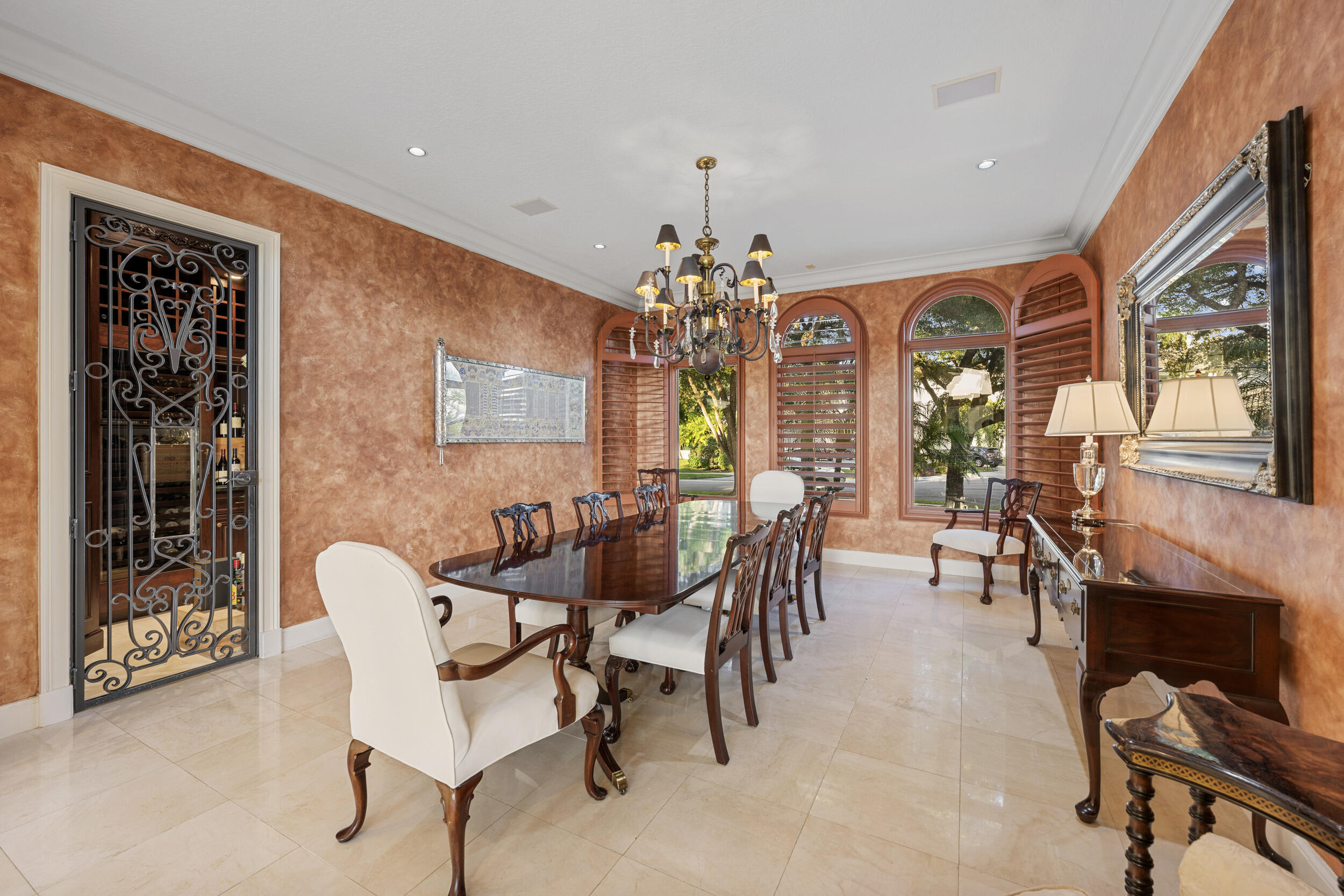 21169 Oakley Court Boca Raton, FL 33433 - Photo 11 of 60 a view of a dining room with furniture and chandelier