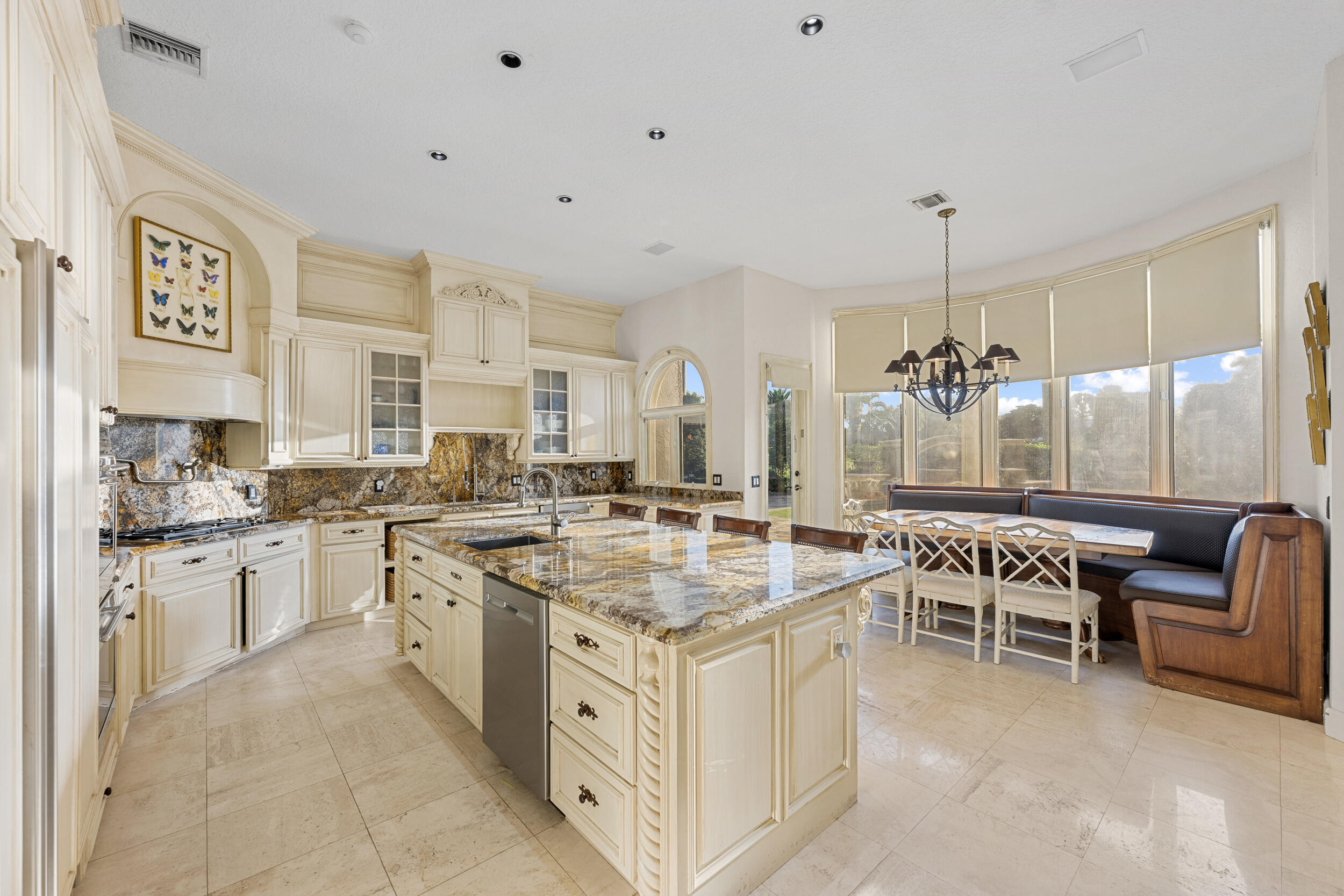 21169 Oakley Court Boca Raton, FL 33433 - Photo 14 of 60 a kitchen with stainless steel appliances granite countertop a stove and cabinets