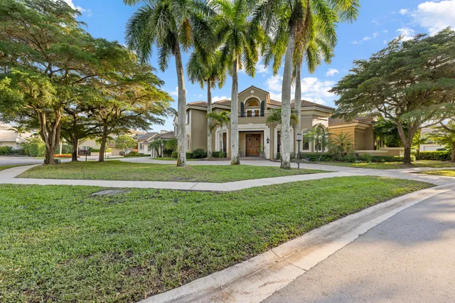 a view of house with outdoor space and trees