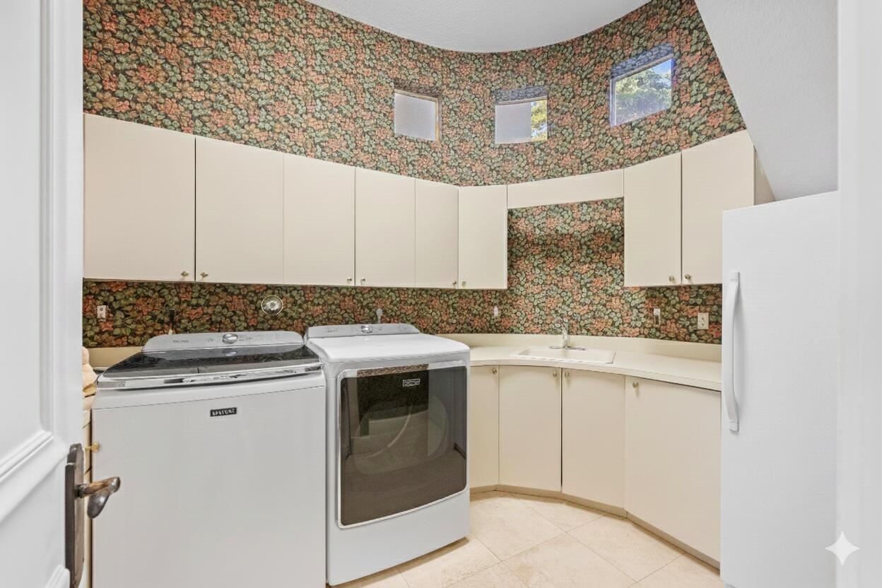 21169 Oakley Court Boca Raton, FL 33433 - Photo 39 of 60 a kitchen with granite countertop white cabinets and white appliances
