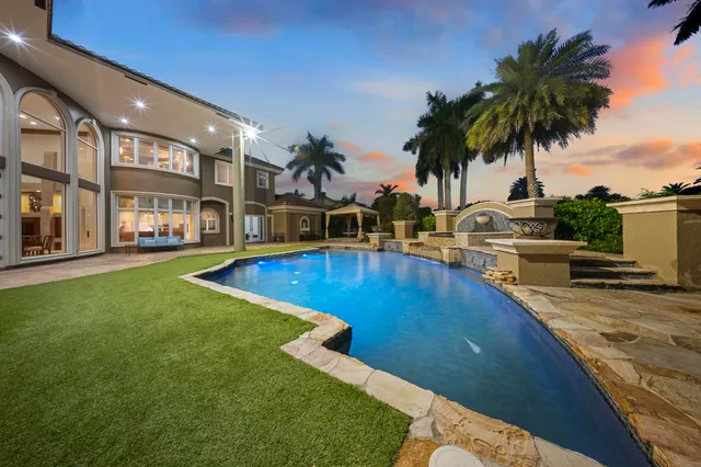 a view of road with palm trees
