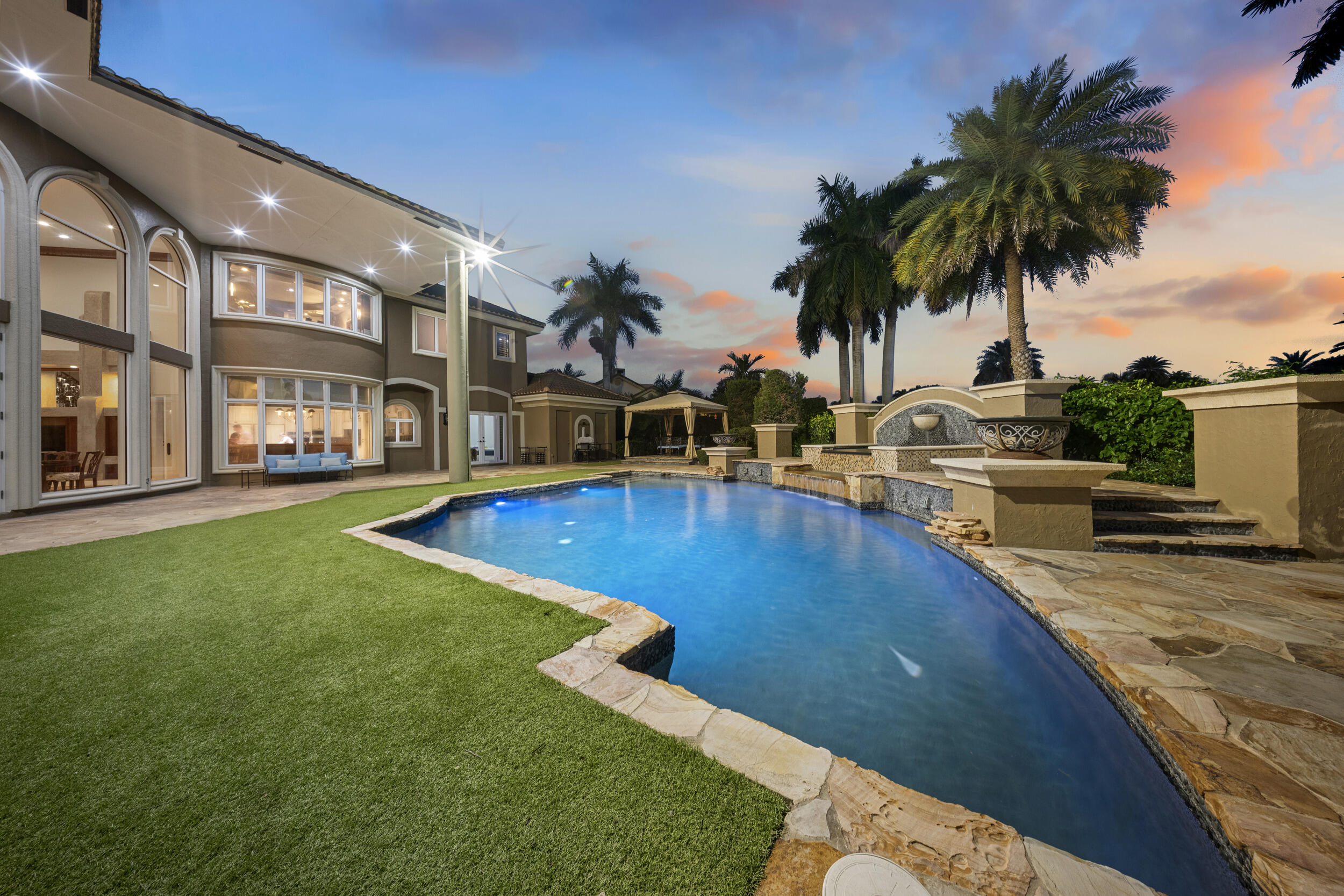 21169 Oakley Court Boca Raton, FL 33433 - Photo 41 of 60 a view of a swimming pool with a lounge chair