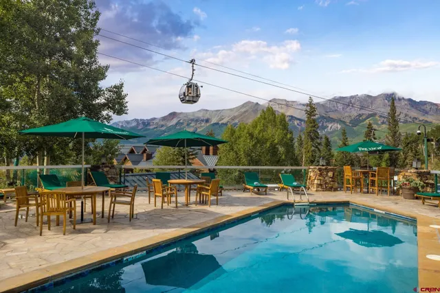 a view of a swimming pool with a patio