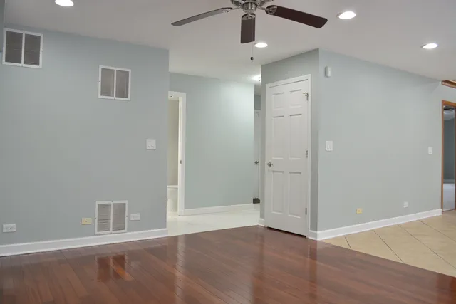 a kitchen with stainless steel appliances granite countertop a refrigerator and a stove