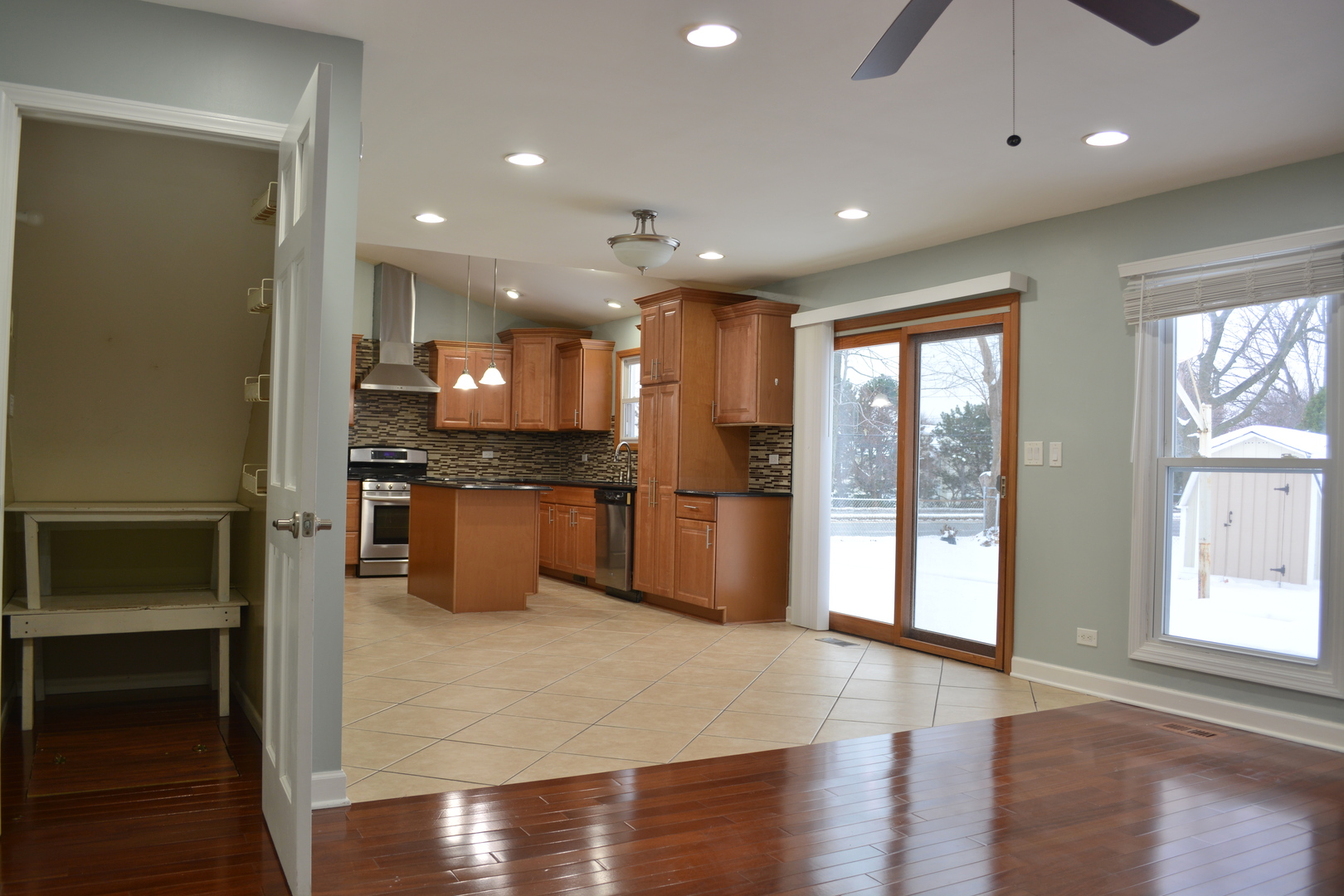 1203 Timber Drive Elk Grove Village, IL 60007 - Photo 14 of 32 a kitchen with stainless steel appliances granite countertop a refrigerator and a stove