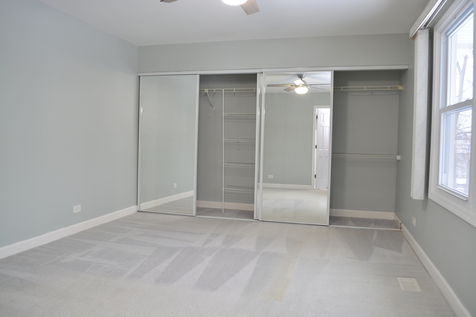 1203 Timber Drive Elk Grove Village, IL 60007 - Photo 21 of 32 a view of an empty room with a window
