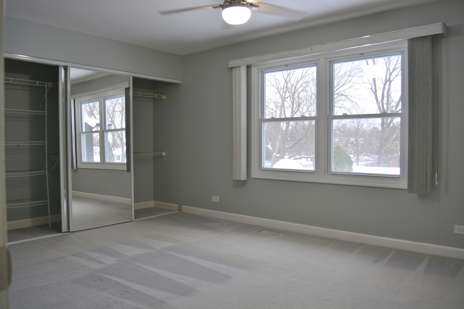 1203 Timber Drive Elk Grove Village, IL 60007 - Photo 22 of 32 a view of an empty room with a window