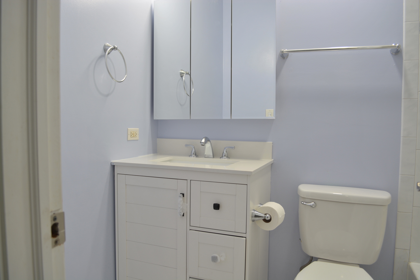 1203 Timber Drive Elk Grove Village, IL 60007 - Photo 24 of 32 a bathroom with a toilet sink vanity and mirror