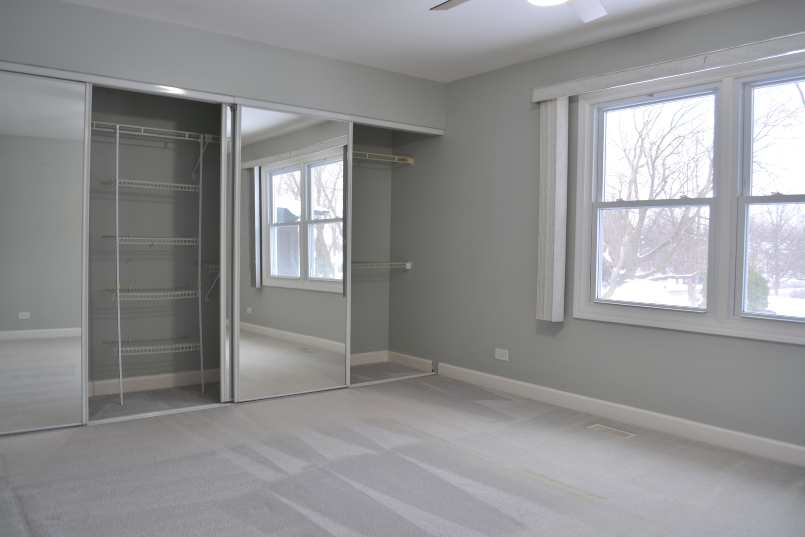 1203 Timber Drive Elk Grove Village, IL 60007 - Photo 25 of 32 a view of an empty room with a window