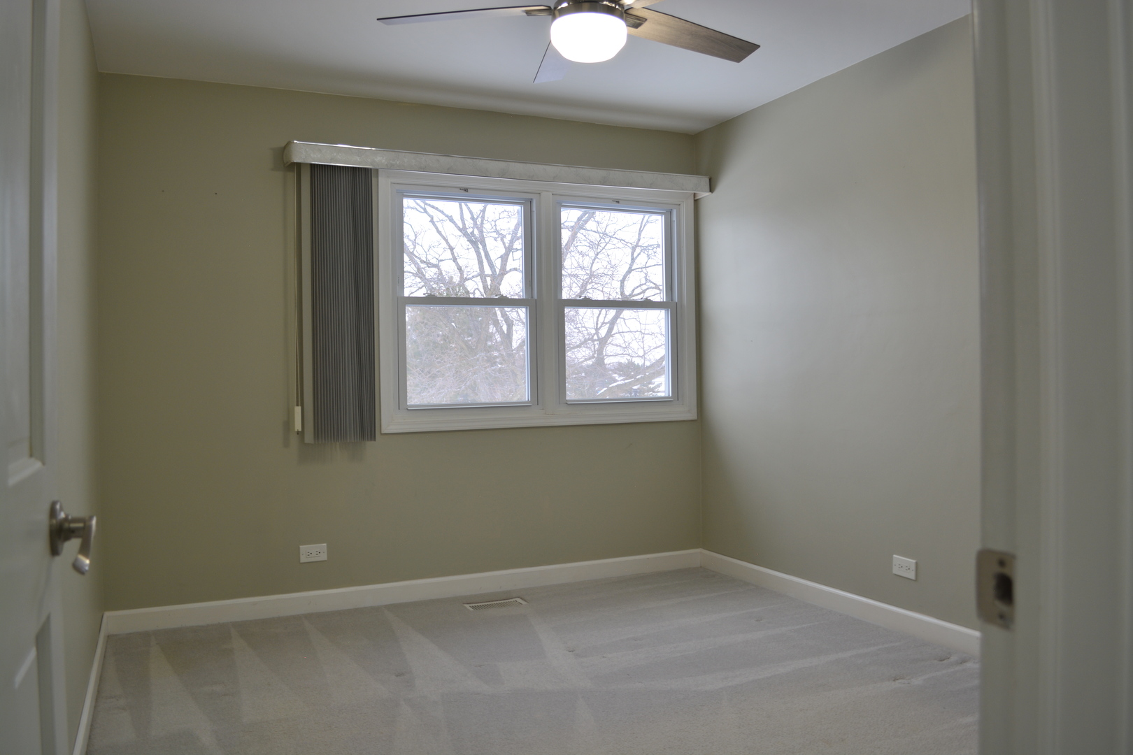 1203 Timber Drive Elk Grove Village, IL 60007 - Photo 30 of 32 an empty room with a window