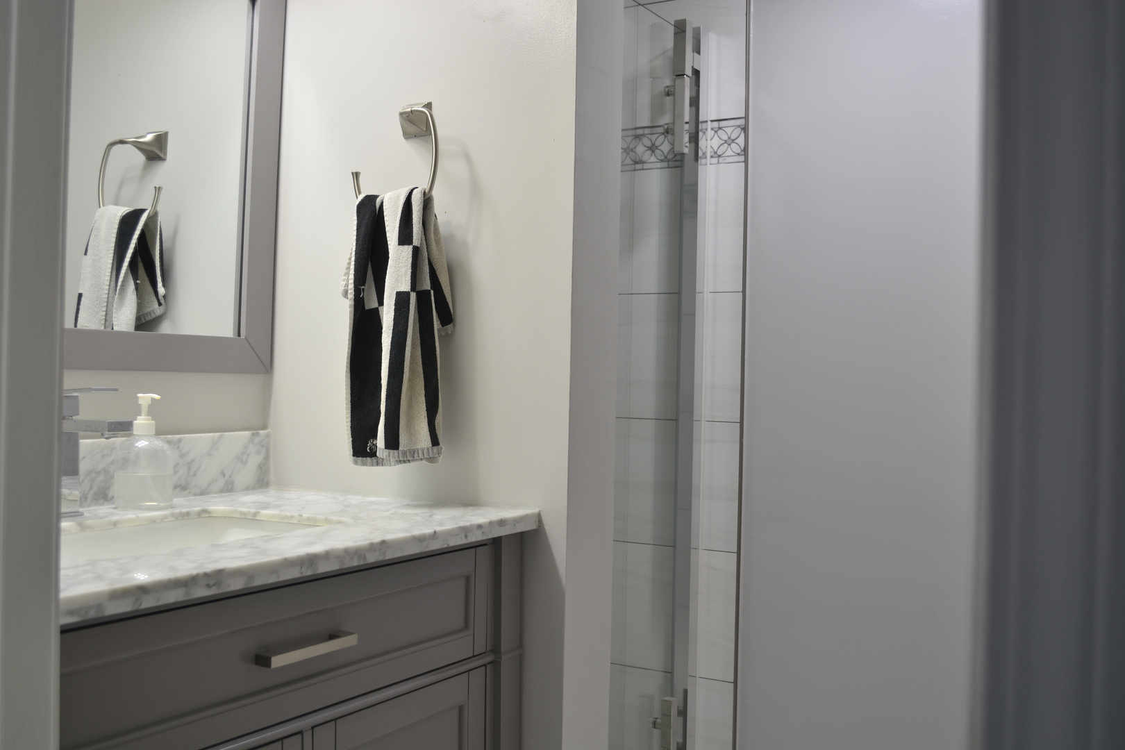1203 Timber Drive Elk Grove Village, IL 60007 - Photo 9 of 32 a bathroom with a granite countertop sink vanity and a mirror