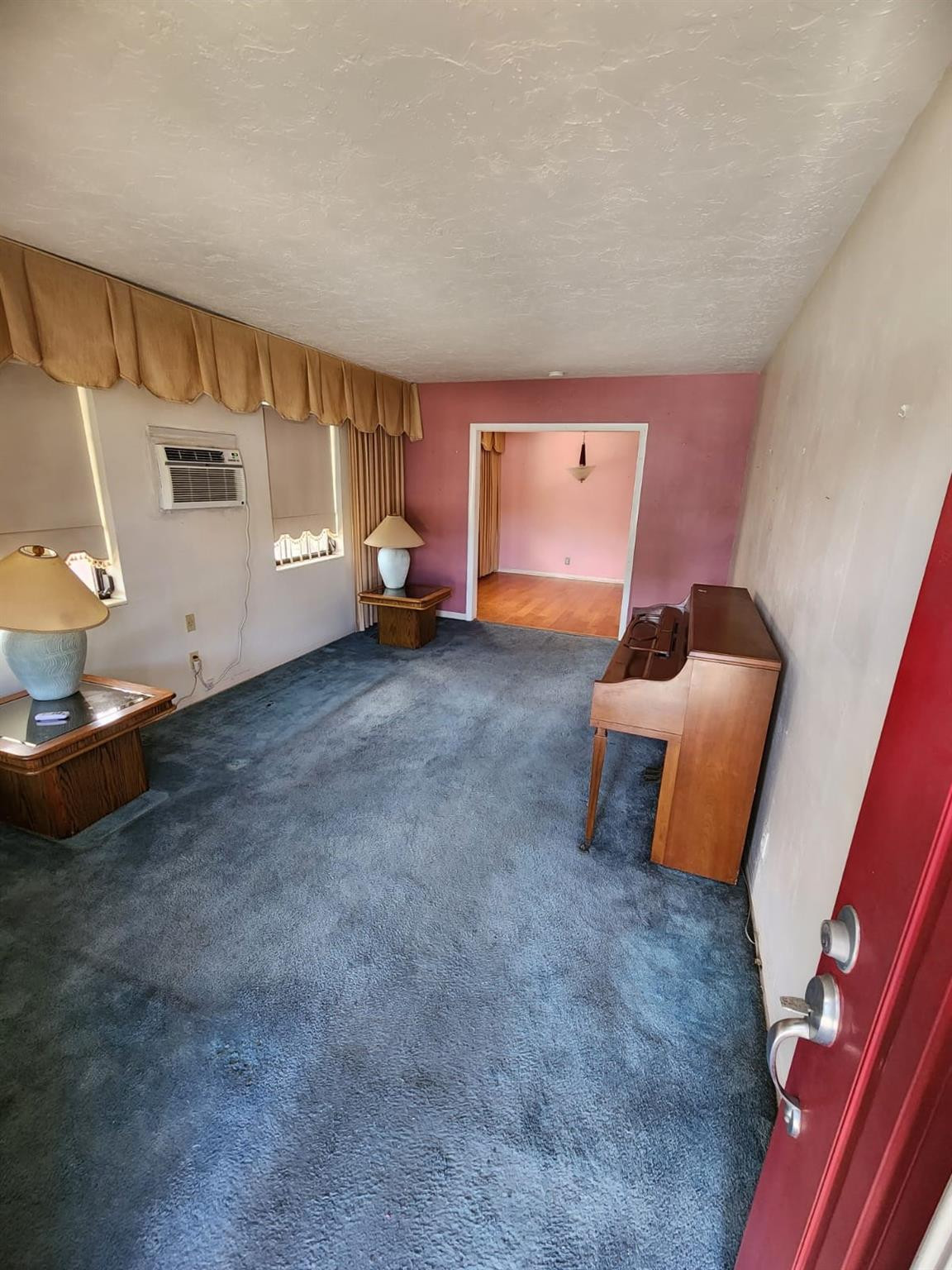75 Northwest 52nd Street Miami, FL 33127 - Photo 5 of 12 a view of a room with furniture and a window
