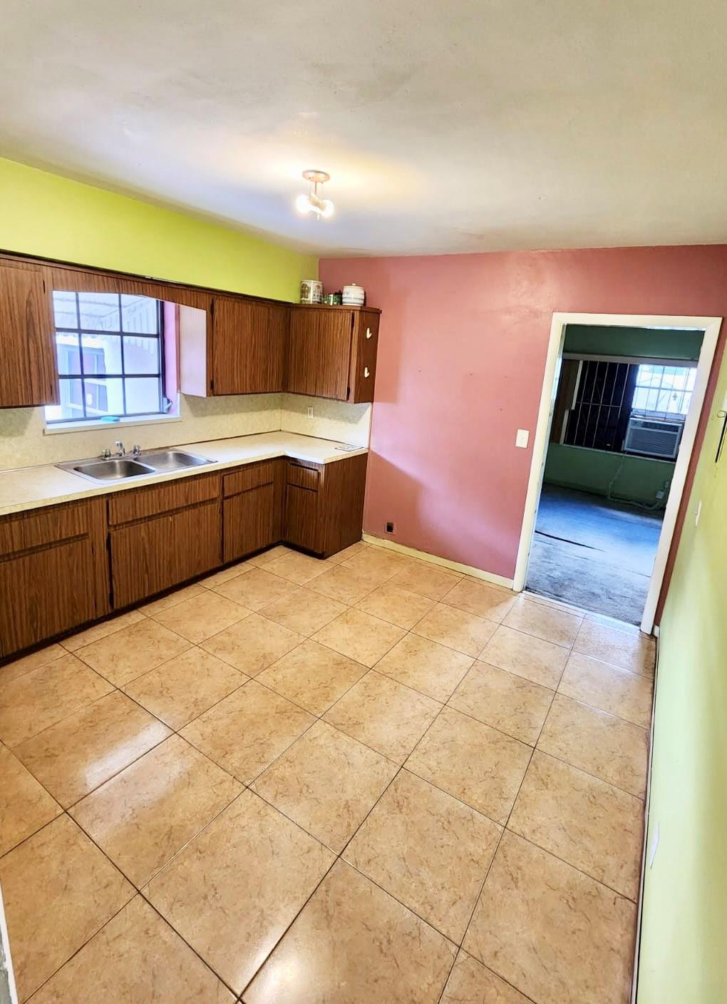 75 Northwest 52nd Street Miami, FL 33127 - Photo 6 of 12 a kitchen with stainless steel appliances a sink and cabinets