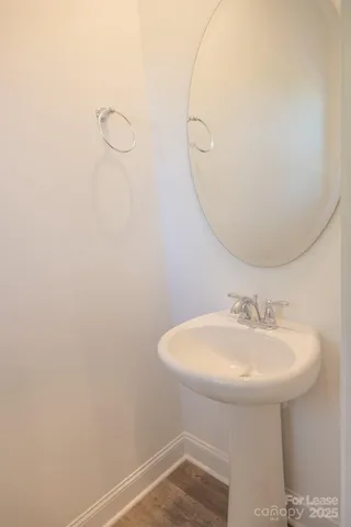 a bathroom with a sink a mirror and a shower