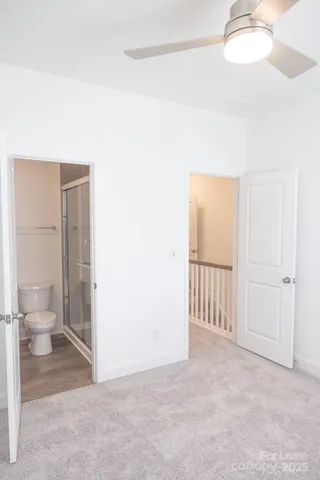 a view of a bathroom with a toilet