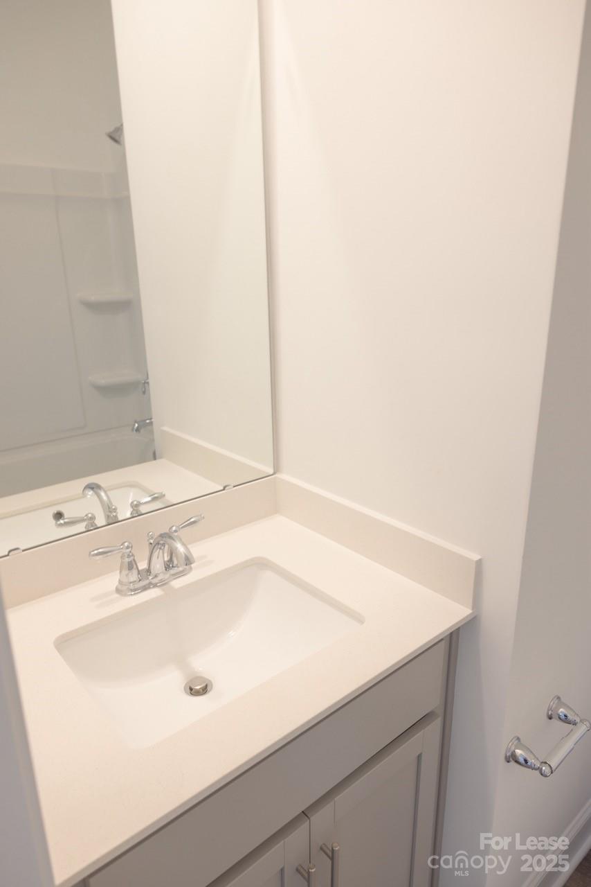 3018 Butler Hl Drive Matthews, NC 28105 - Photo 9 of 14 a bathroom with a sink and a mirror