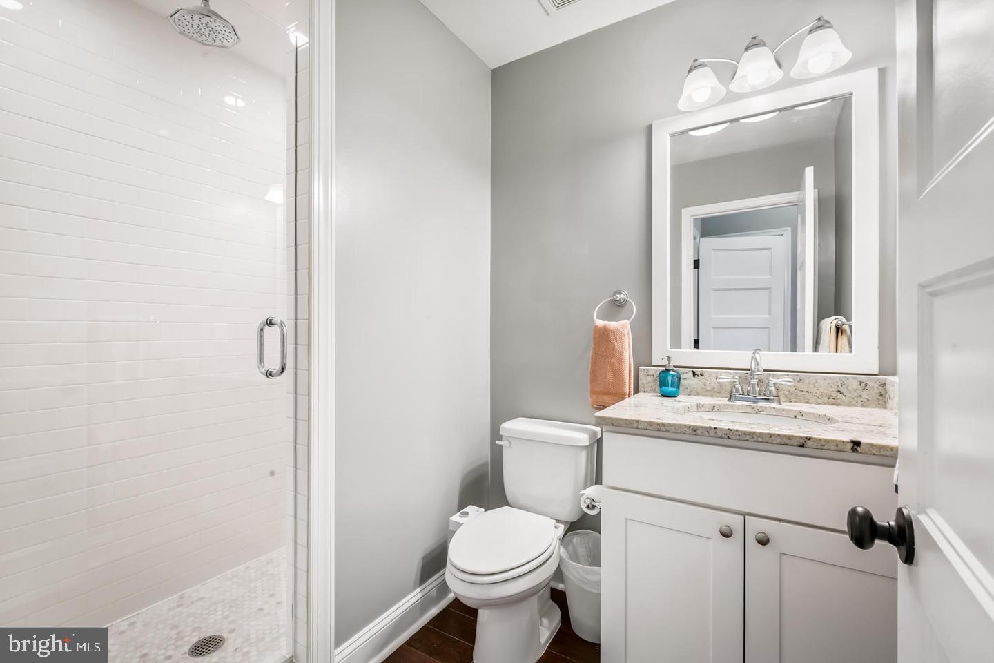 3019 Keswick Road Baltimore, MD 21211 - Photo 17 of 29 a bathroom with a toilet sink and mirror