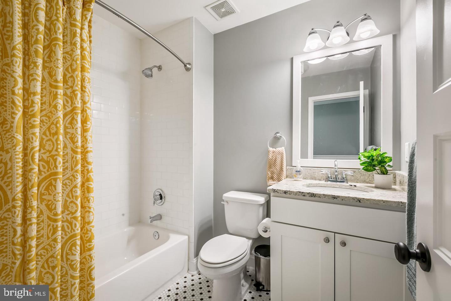 3019 Keswick Road Baltimore, MD 21211 - Photo 22 of 29 a bathroom with a sink toilet and shower