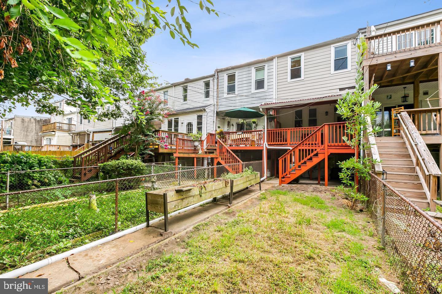 3019 Keswick Road Baltimore, MD 21211 - Photo 27 of 29 a front view of a house with a yard table and chairs