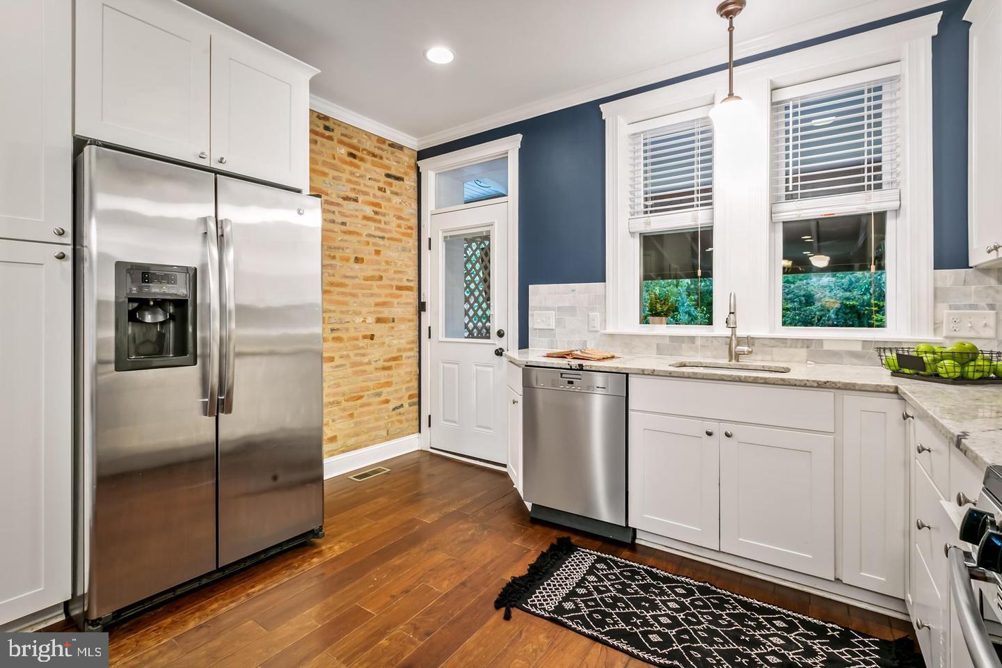 3019 Keswick Road Baltimore, MD 21211 - Photo 6 of 29 a kitchen with stainless steel appliances a refrigerator and a sink