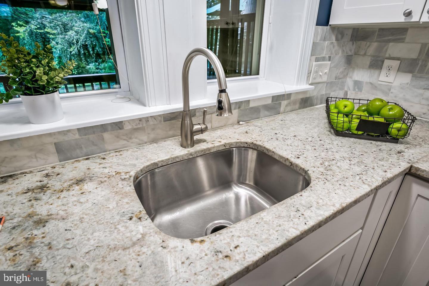 3019 Keswick Road Baltimore, MD 21211 - Photo 7 of 29 a kitchen with granite countertop a sink and a window