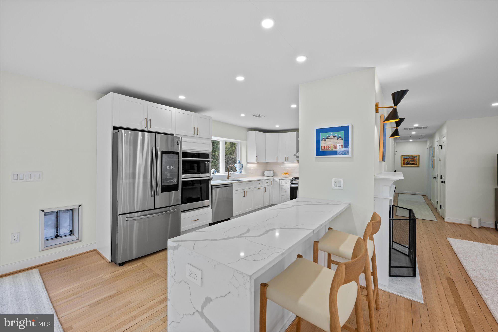 6700 Rannoch Road Bethesda, MD 20817 - Photo 11 of 36 a kitchen with stainless steel appliances a refrigerator and a stove top oven