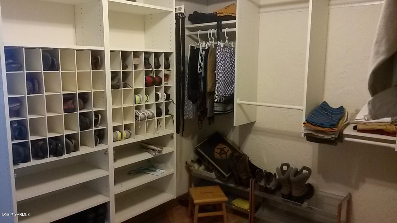 11604 Summitview Ext Road Yakima, WA 98908 - Photo 18 of 41 a view of walk in closet with clothes and shoes