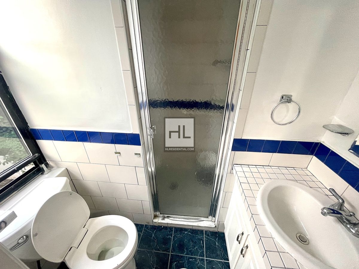 51-28 35th Street, Unit 2 Queens, NY 11101 - Photo 7 of 7 a bathroom with a toilet and a sink