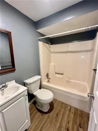 a bathroom with a toilet a sink and a bathtub