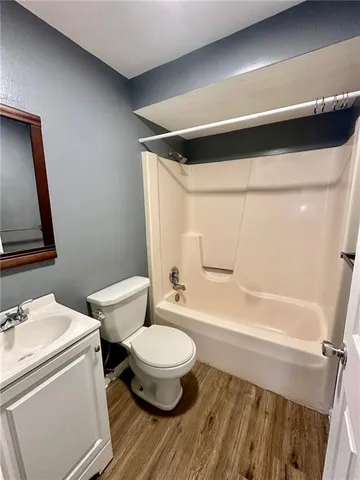a bathroom with a toilet a sink and a bathtub