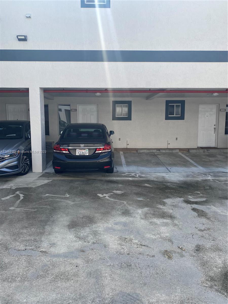 240 Southwest 15th Road, Unit 110 Miami, FL 33129 - Photo 16 of 17 a car parked in garage