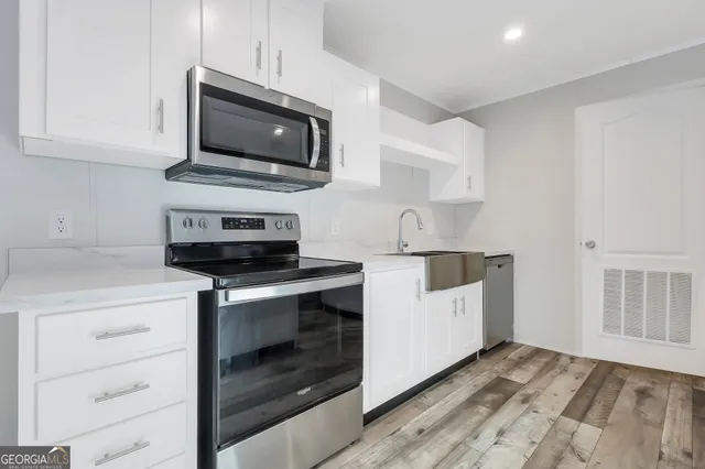 a kitchen with a stove and a microwave