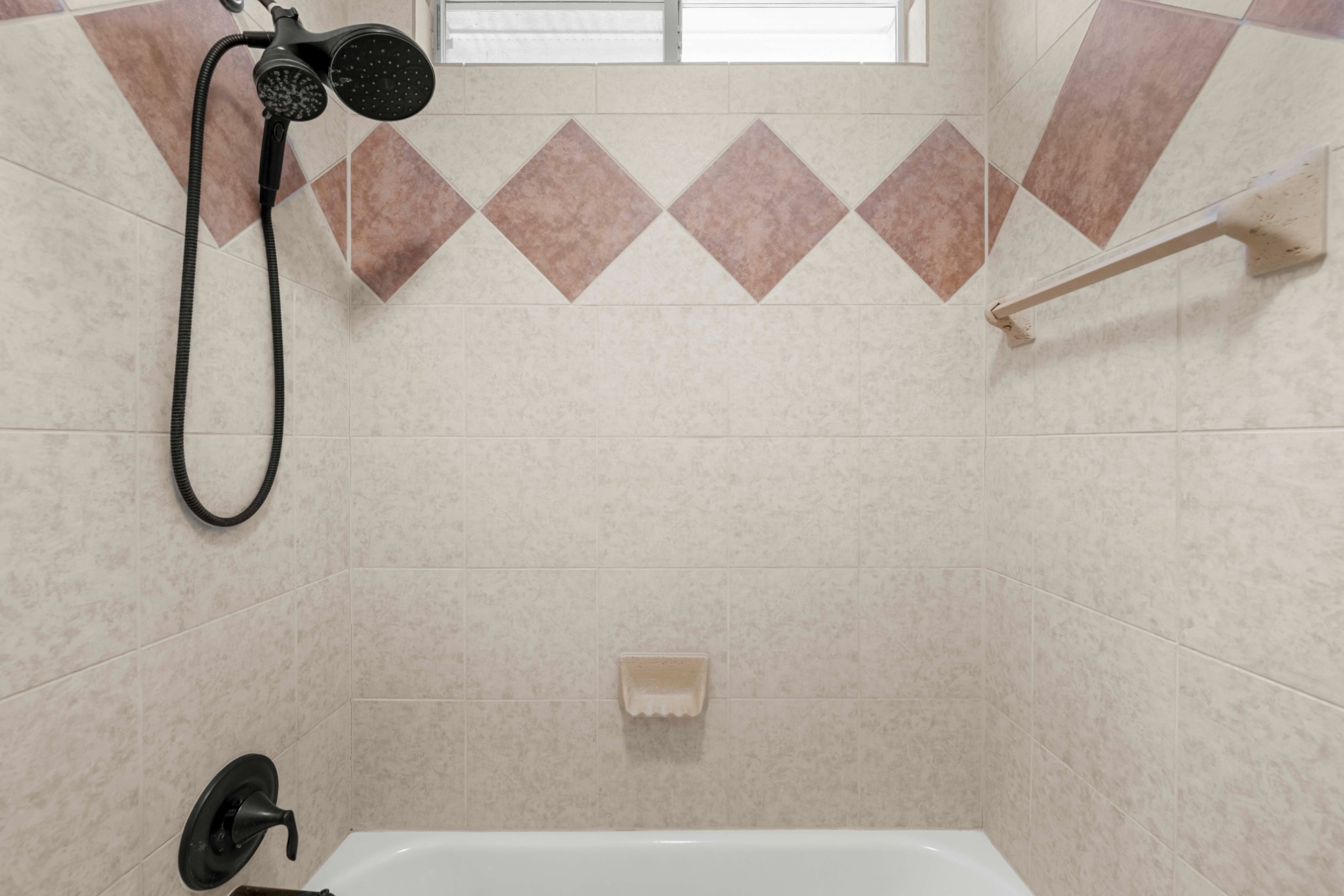 3903 Remington Road Cedar Park, TX 78613 - Photo 18 of 29 A well-appointed shower with elegant tilework and a window for natural light.