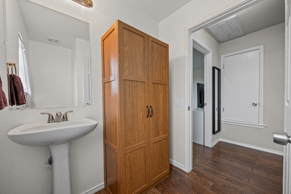 18400 Belfry Pass Manor, TX 78653 - Photo 12 of 22 a bathroom with a sink a mirror and shower