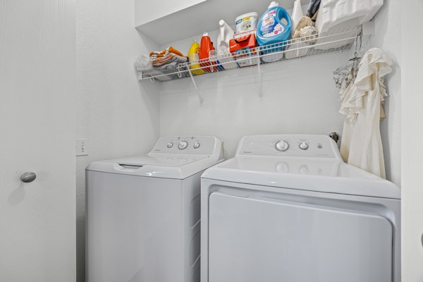 18400 Belfry Pass Manor, TX 78653 - Photo 15 of 22 a utility room with dryer and washer