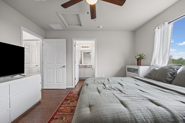 18400 Belfry Pass Manor, TX 78653 - Photo 5 of 22 a bedroom with a bed and a flat screen tv