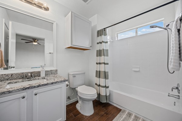 18400 Belfry Pass Manor, TX 78653 - Photo 6 of 22 a bathroom with a granite countertop sink toilet and shower
