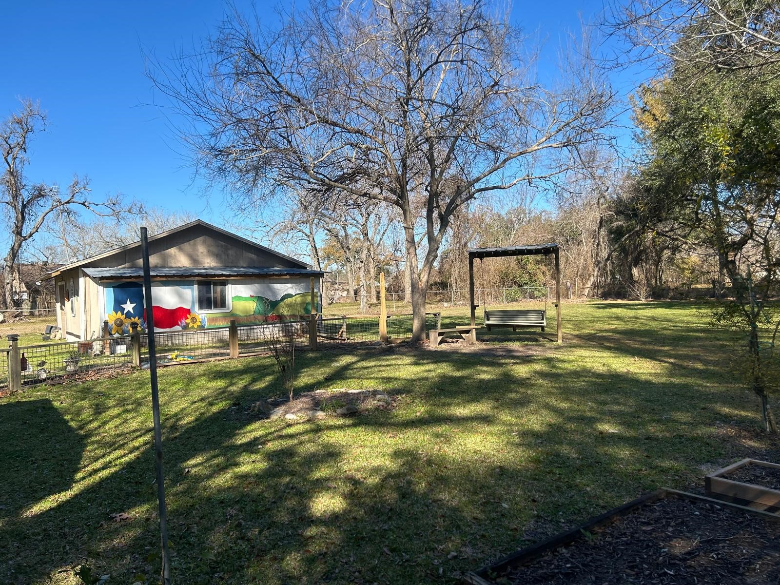 401 Billington Street Clute, TX 77531 - Photo 19 of 22 a view of a park with swings and slides